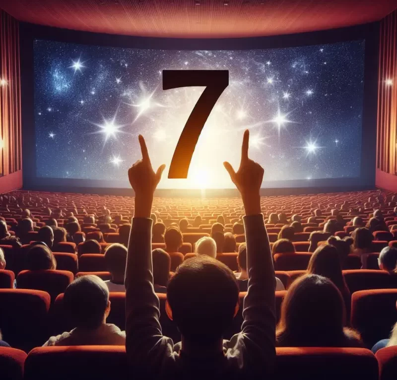 audience holding number 7 in front of cinema movie